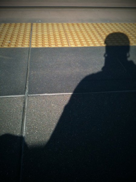 Sittin on the board, waitin' for the train.